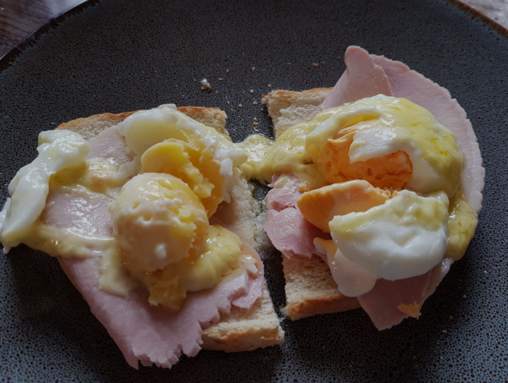 Eggs Benedict with colorful hollandaise